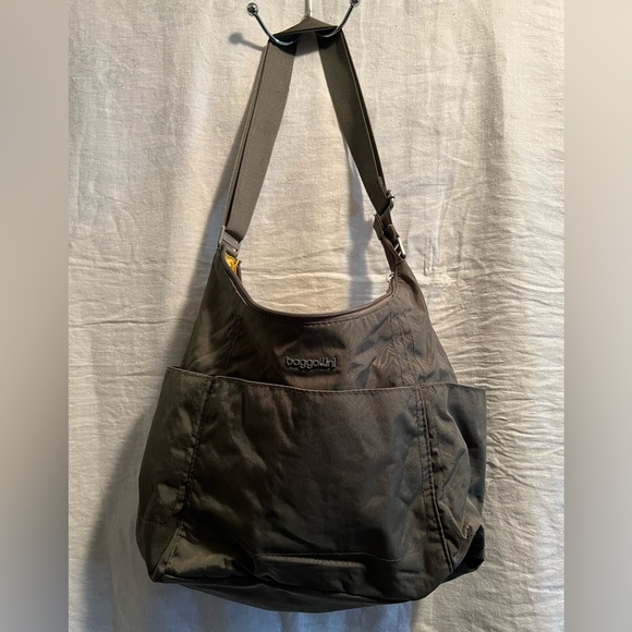 Baggallini Handbags - Baggallini Hobo Bag in gray. Lots of pockets. Adjustable strap. Fits lots.